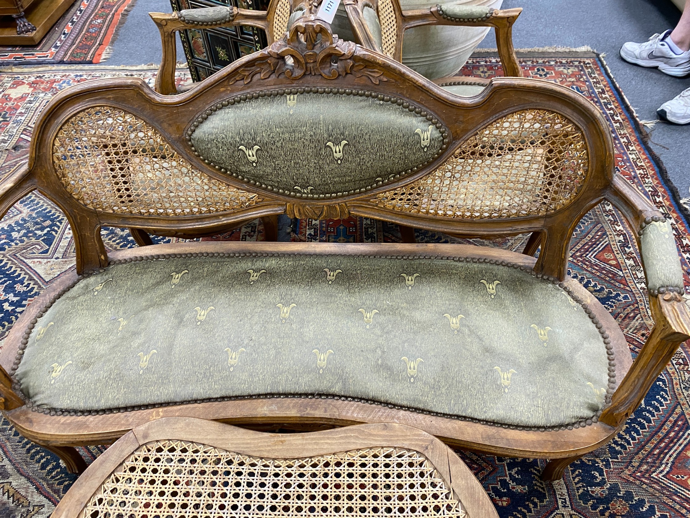 An early 20th century French caned beech four piece salon suite, settee length 130cm, height 86cm